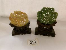 2 jade medallions on stands