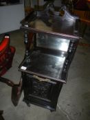 A Victorian ebonised coal cabinet