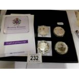 2 silver proof diamond wedding coins and 2 silver proof Brittania coins
 
3 coins are 2007
1 coin