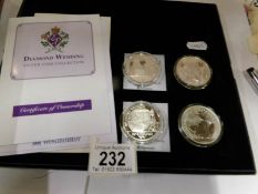 2 silver proof diamond wedding coins and 2 silver proof Brittania coins
 
3 coins are 2007
1 coin