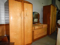 A 1960's birds eye maple bedroom suite comprising 2 wardrobes, dressing table. bedside table and