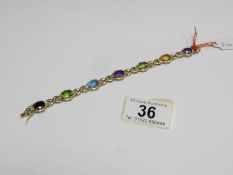 A 9ct? gold bracelet set multi gem stones