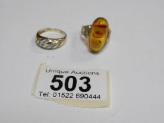 A 9ct gold ring set oval amber size Q and a 9ct gold diamond set twist ring size N