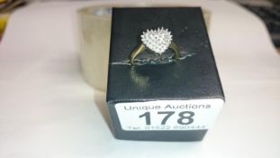 A heart shaped yellow gold diamond ring, size L