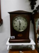 An inlaid mantel clock