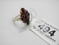 A 9ct gold marquise shape garnet set ring, size O