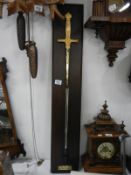 A replica Napoleonic sword on display board