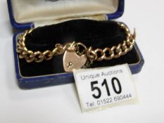 A 9ct rose gold bracelet with rose gold lock, Birmingham 1908
 
This weighs 20gms