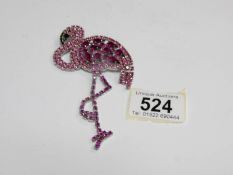 A Butler and Wilson flamingo brooch