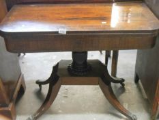 A Regency brass inlaid card table