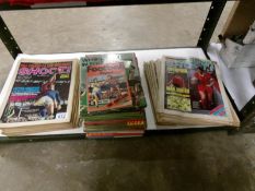 A quantity of football books and shoot magazines