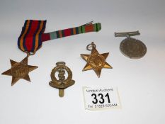3 WW2 medals and a badge