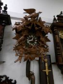 A large musical Black forest cuckoo clock carved with various birds
 
In good condition