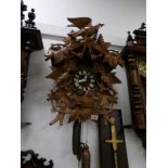 A large musical Black forest cuckoo clock carved with various birds
 
In good condition