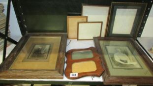 A quantity of wooden photo frames some with old photographs