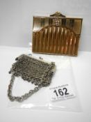 An old chain mail purse and a City of London cigarette case