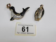 A penguin brooch and a seal brooch