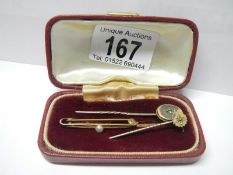 2 gold stick pins with diamonds and an Edwardian gold and pearl brooch