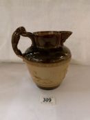 A Royal Doulton salt glaze jug with lurcher handle