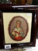 A framed hand painted portrait of a girl on ceramic plaque
