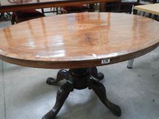 An oval inlaid mahogany loo table