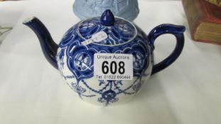 An art nouveau Ridgway blue and white teapot
 
There is some very small nibbling to glaze on top