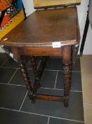 An oak barley twist gate leg table
 
Height is 72.5cm
Top 90cm x 46cm with leaves down
Top