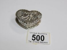 A silver heart shaped box,