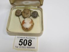 A Victorian lava cameo brooch and a shell cameo brooch in 9ct gold