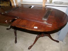 A twin pillar mahogany dining table