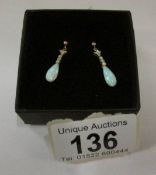 A pair of 9ct gold opal drop earrings