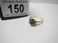 An 18ct sapphire and diamond ring, size Q