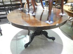 A Victorian rosewood circular dining table