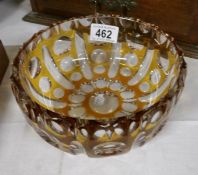 An amber cut glass bowl
 
There are a couple of very small flea bite nibbles to rim but no other