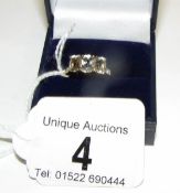 A 9ct gold ring set aquamarine and with diamond set shoulders,