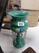 A Victorian turquoise glass hand painted lustre vase