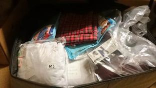 A suitcase of linen etc