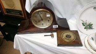 A mantel clock and a barometer