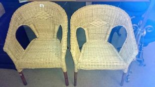 A pair of cane chairs