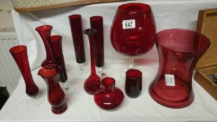 A quantity of red glass ware