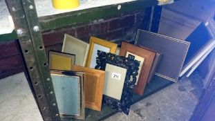 A shelf of assorted photo frames