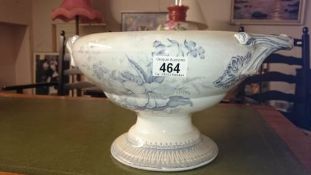 A large blue and white footed bowl