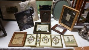 A quantity of pictures and picture frames