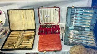 4 cased sets of cutlery