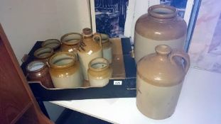 A quantity of stoneware jars