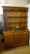 An open rack pine dresser