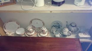 A shelf of china including Oriental