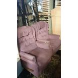 A pair of recliner arm chairs