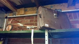 A leather briefcase and a trolley