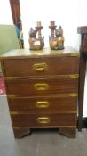 A 4 drawer chest with brass corners and brass handled